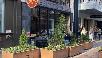 downtown storefront with planter boxes in front