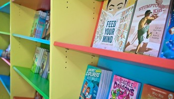 colorful bookshelves full of children's books