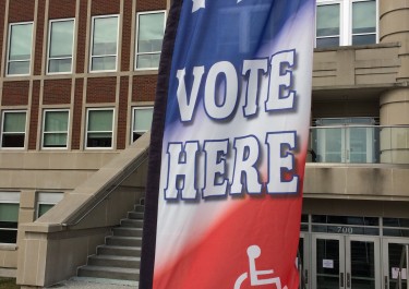 Vote Here banner in front of Howard Office Building