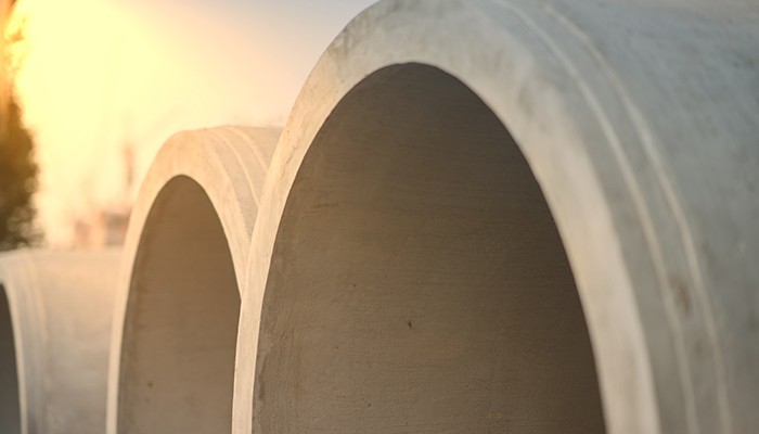 large pipes with a sunset background