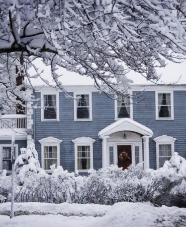 House in winter snow 