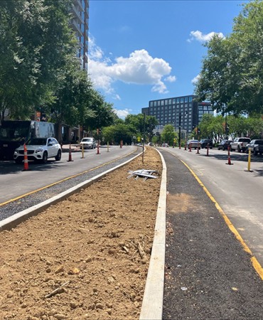 Concrete center island work complete looking west bound on Demonbreun Street