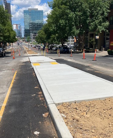 Concrete center island work complete looking east bound on Demonbreun Street 