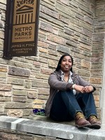 Alana sitting in front of the Parks Department office